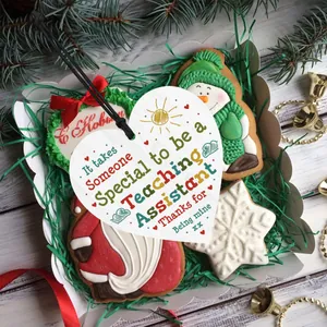 Detailed view of heart-shaped wooden thank you gift for teaching assistant in a gift box