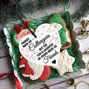 Close-up of heart wooden plaque with inspirational text in a festive gift box