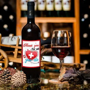 Detailed view of Nurse Thank You wine bottle labels on dark glass in an elegant cellar setting