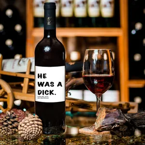 Macro detail of creative wine bottle label featuring He Was A Dick text for party gift
