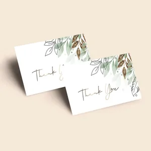 Detail showing watercolor leaf patterns and gold Thank You script on matte paper cards