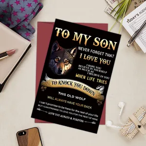 Detailed view of wolf-themed 'TO MY SON' greeting card on a textured tabletop