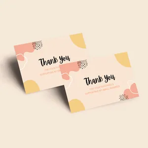 Detail view of two minimalist thank you cards with abstract geometric shapes and dots