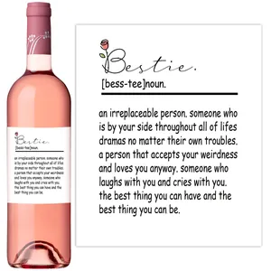 Close-up of creative wine bottle label sticker with Bestie definition for party decor
