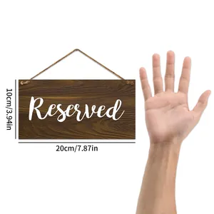 Detailed view of the 20x10cm wooden Reserved sign with rustic jute rope for hanging