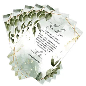 Macro detail of 10x15cm floral wedding thank you cards with green leaves and gold frame