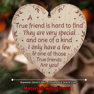 Detail of 10cm heart-shaped wooden plaque with floral print and friendship quote