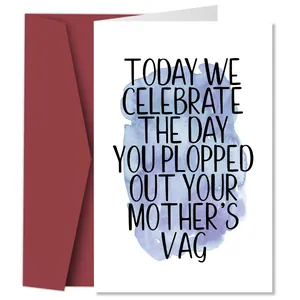 Close-up of funny birthday card with artistic text and elegant dark red envelope set