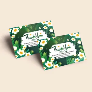 Detail of tropical dark green thank you cards with floral, leaf and butterfly design