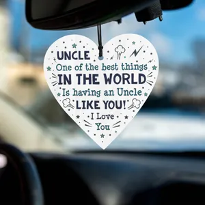 Wooden heart-shaped hanging ornament for Uncle with star motifs and black string in a car