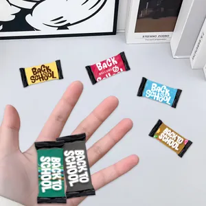 Close-up of colorful Back to School theme pillow candy packaging held in hand