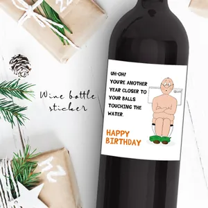 Detailed view of funny birthday wine bottle label with cartoon illustration on bottle