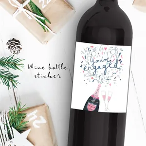 Close-up of You're Engaged wine label with champagne and ring art on a bottle