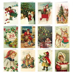 Flat lay of 12 vintage Christmas cards with Victorian illustrations and festive designs