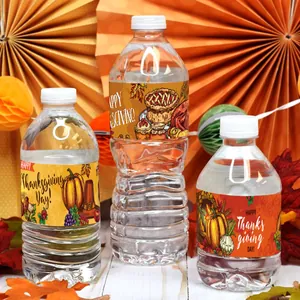Close-up of Thanksgiving water bottle labels with pumpkins and turkey harvest designs