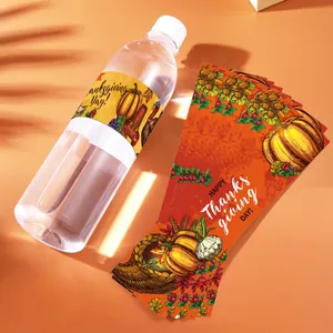 Close-up of Happy Thanksgiving water bottle labels with pumpkins and harvest motifs