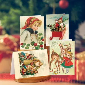 Close-up of vintage Christmas cards with hand-drawn illustrations and festive envelopes