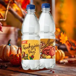 Thanksgiving water bottle labels with turkey and pumpkin designs in autumn yard setting