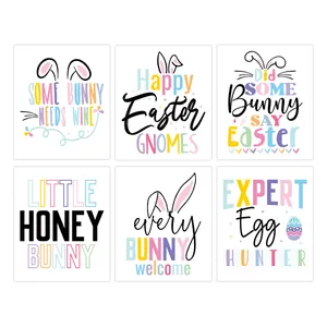 Set of six colorful Easter wine bottle labels with rabbit ears and festive slogans