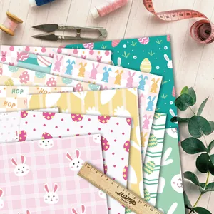 Detail of Easter rabbit pattern scrapbook papers with macaron colors and hop designs