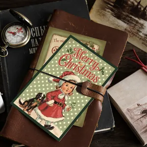 Vintage Merry Christmas decorative card featuring a girl and dog on a leather journal
