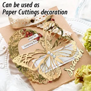 Detailed laser-cut gold butterflies with white pearls on floral scrapbooking paper