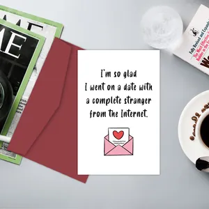Funny greeting card with humorous text and red envelope set against a desktop background