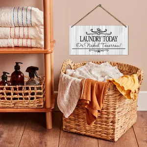 Wooden laundry room wall sign with Laundry Today Or Naked Tomorrow text and twine rope