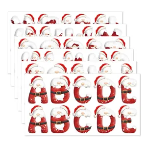 Christmas alphabet sticker sheets featuring Santa Claus hats and snowy patterns for DIY crafts