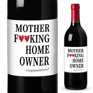 Detail of funny home owner wine labels with hearts and congratulations text on a bottle