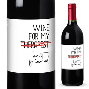 Close-up of a funny wine bottle label with witty text on a dark glass bottle surface