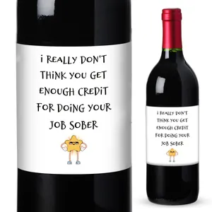 Detailed view of self-adhesive wine labels with funny quotes and cartoon star on dark bottles