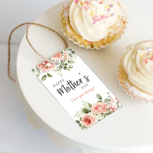 Floral Mother's Day gift tags with pink roses and twine on a cupcake display stand