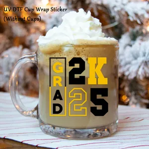 UV DTF graduation cup wrap sticker with GRAD 2K25 text applied on a glass mug