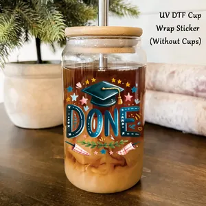 Detail of Graduation UV DTF transfer sticker with DONE text and cap on glass cup