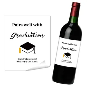 Detail of graduation wine bottle labels showing artistic fonts and cap icons