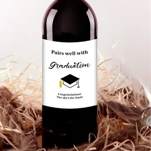 Close-up of graduation wine bottle label with congrats text and cap icon decor