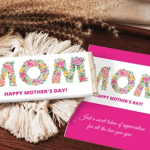 Detailed view of floral Happy Mother's Day chocolate wrappers on a textured wooden background