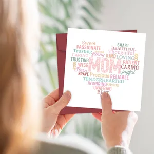 Detail of colorful heart-shaped Mother's Day card with a burgundy envelope and MOM design