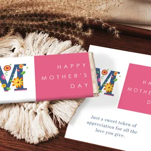 Close-up of Mother's Day floral chocolate bar wrappers with gift cards on a rustic mat