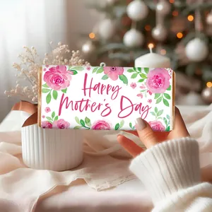 Detail of floral Mother's Day chocolate bar wrapper held in hand with rose design