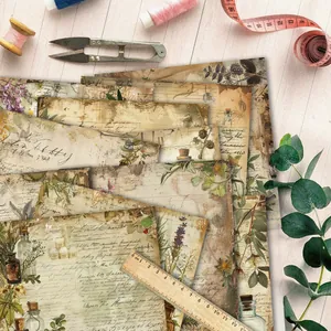 Vintage floral scrapbooking paper with botanical patterns and calligraphy in flat lay