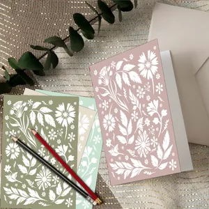 Set of 12 watercolor wildflower note cards with blank envelopes on a textured tablecloth