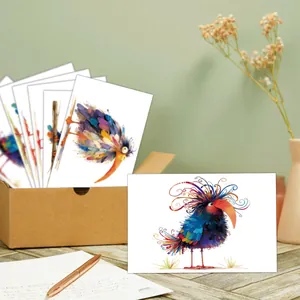 Artistic bird birthday cards set with floral illustrations in a kraft paper storage box