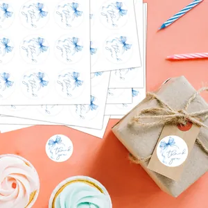 Detail of round Thank You stickers with blue watercolor bow for gift packaging