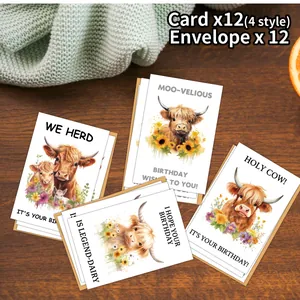Set of 12 watercolor highland cow birthday cards with envelopes on a rustic wooden desk