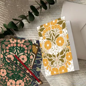 Set of 12 vintage floral note cards with envelopes and pencils on a gold fabric