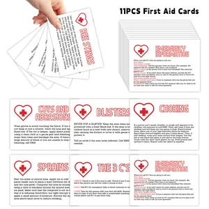 Macro view of 11-piece emergency first aid guide cards showing injury care instructions
