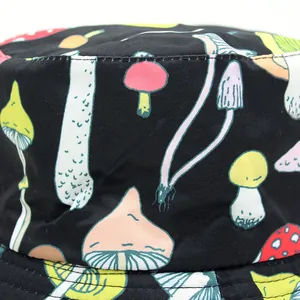 Reversible bucket hat with cute colorful mushroom print on black cotton canvas fabric