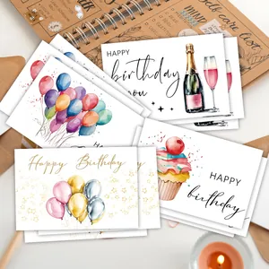 Dettaglio di biglietti di auguri ad acquerello con palloncini e cupcakes dipinti a mano